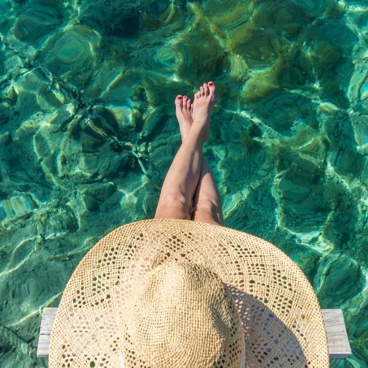 Traveler overlooking clear tropical water